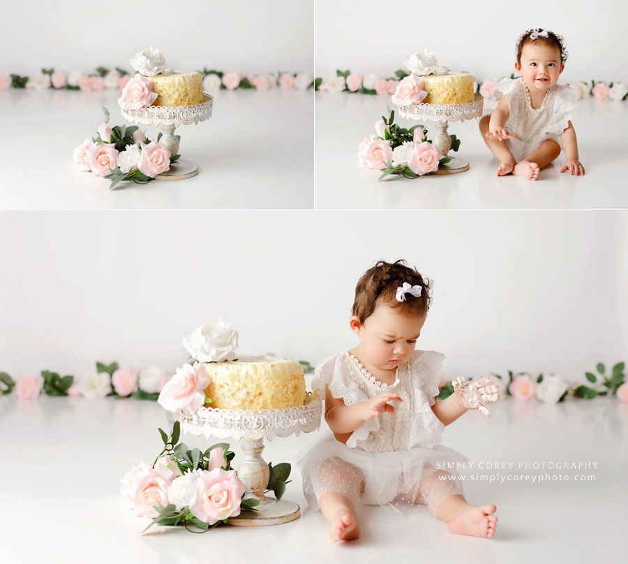 Villa Rica cake smash photographer, baby girl on white studio set with flowers