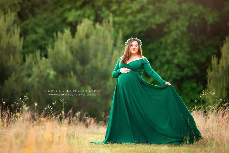 Carrollton maternity photographer in Georgia, mom in flowy green dress outside in field