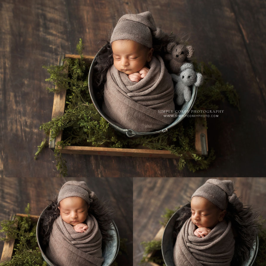 Hiram newborn photographer, baby boy in brown swaddle and hat with bucket