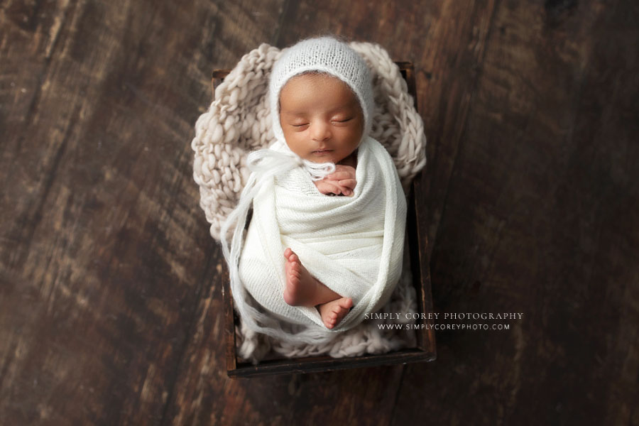 newborn photographer near Atlanta, baby boy sleeping in ivory wrap and hat