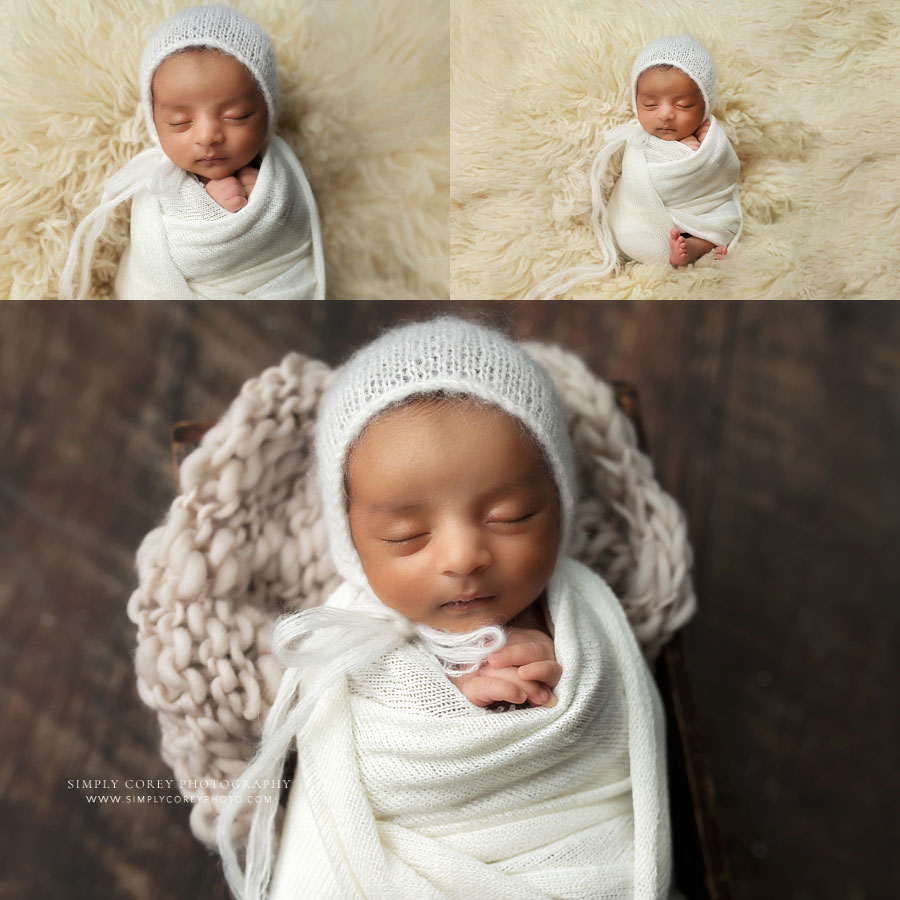 newborn photographer near Peachtree City, baby boy in ivory swaddle and hat on flokati