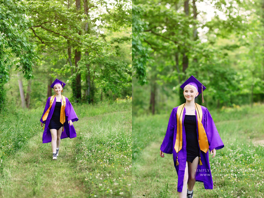 Douglasville senior portraits, teen girl in cap and gown walking outside in field