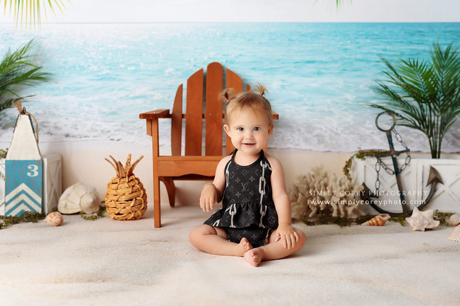 baby photographer near Douglasville, beach studio set with Louis Vuitton bathing suit