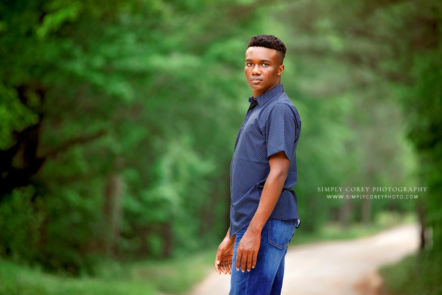 senior portrait photographer near Atlanta, teen boy outside on country road