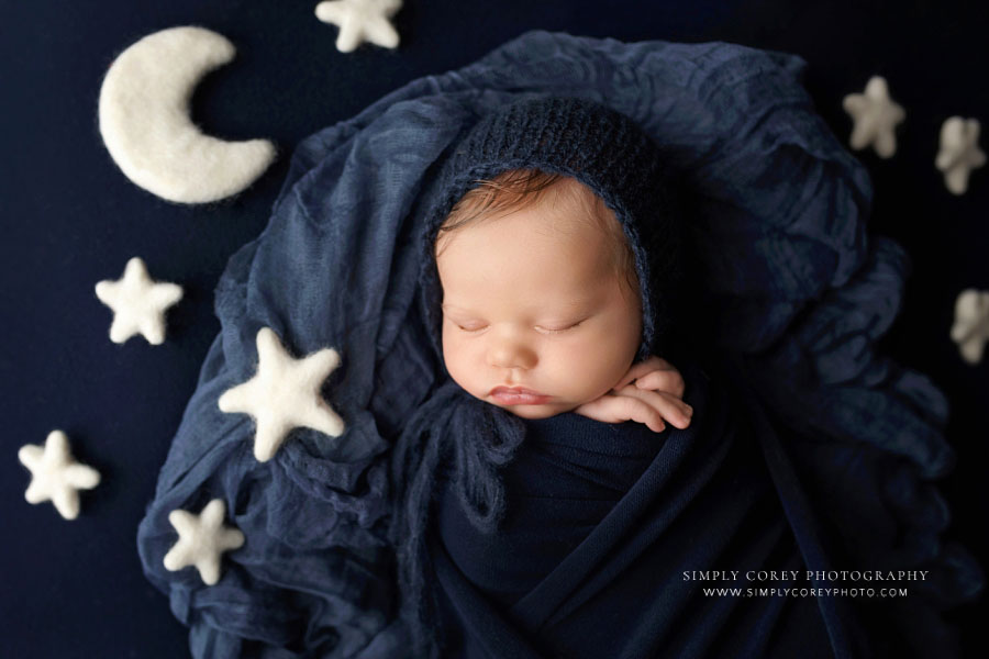 Atlanta newborn photographer, baby boy in navy blue with moon and stars studio props
