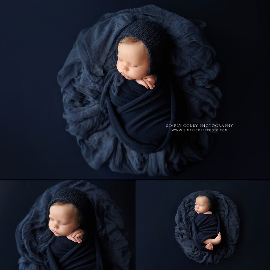 newborn photographer near Mableton, GA; baby boy in studio with blue wrap and hat
