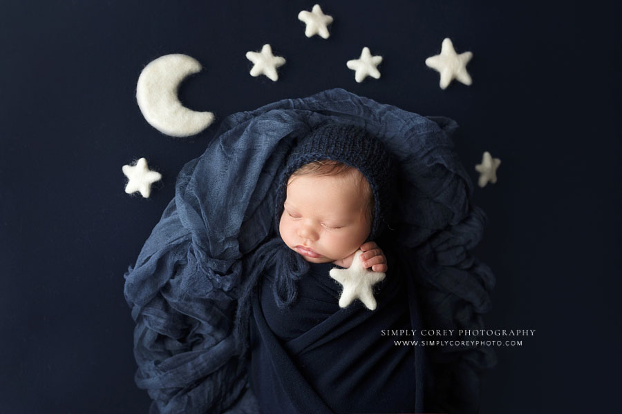 Newnan newborn photographer, baby boy in blue with moon and stars studio set