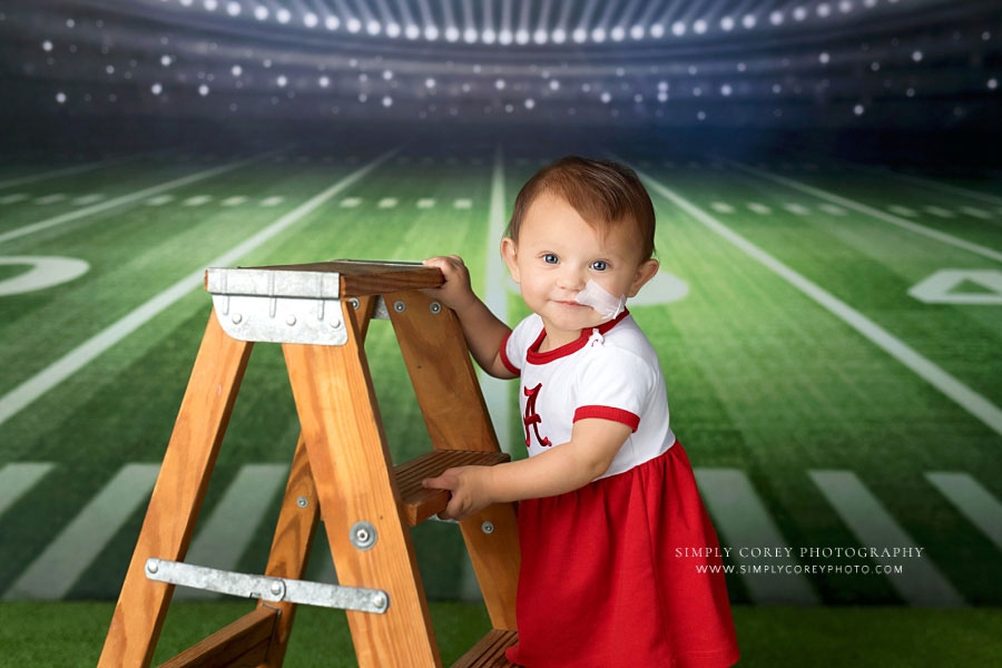 Lithia Springs baby photographer, football cheerleader theme for milestone session