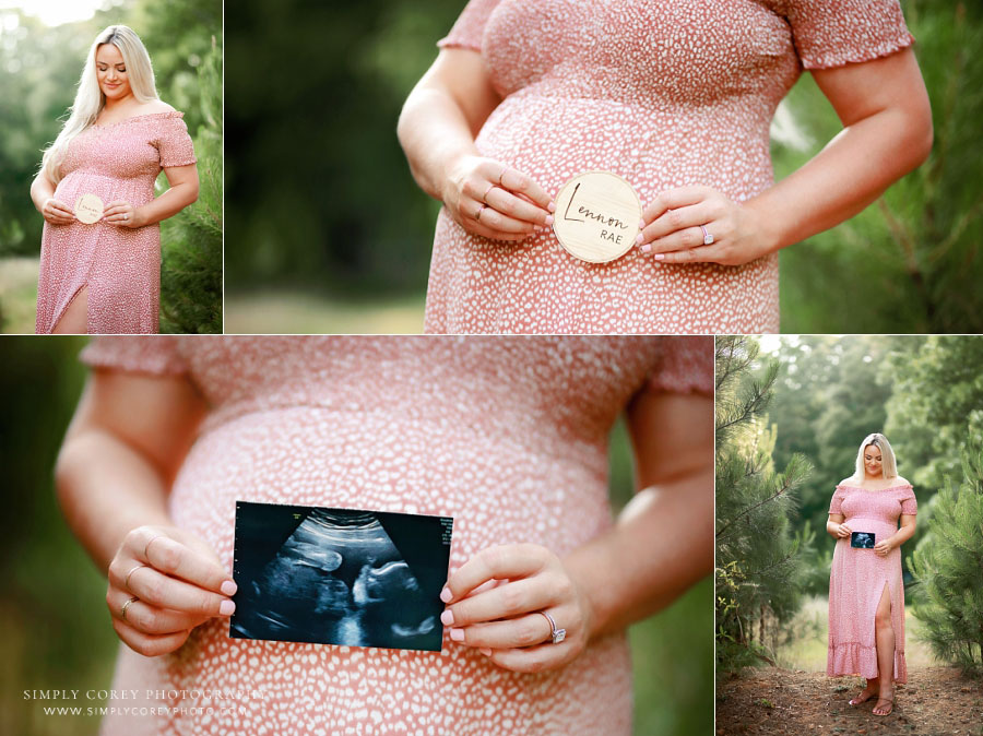 maternity photographer near Carrollton, GA; expecting mom holding ultrasound photo outside