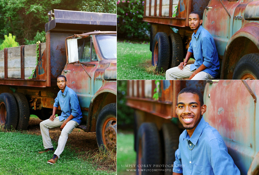 senior portrait photographer near Mableton, teen boy outside sitting on vintage dump truck