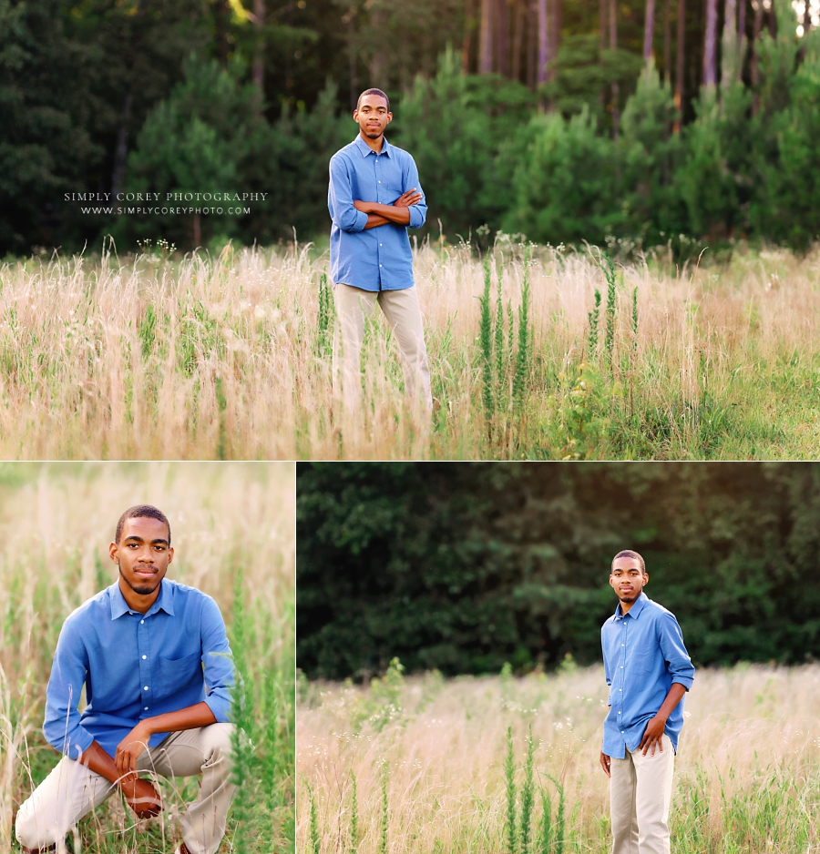 senior portrait photographer near Dallas, GA; teen boy outside in field in blue shirt