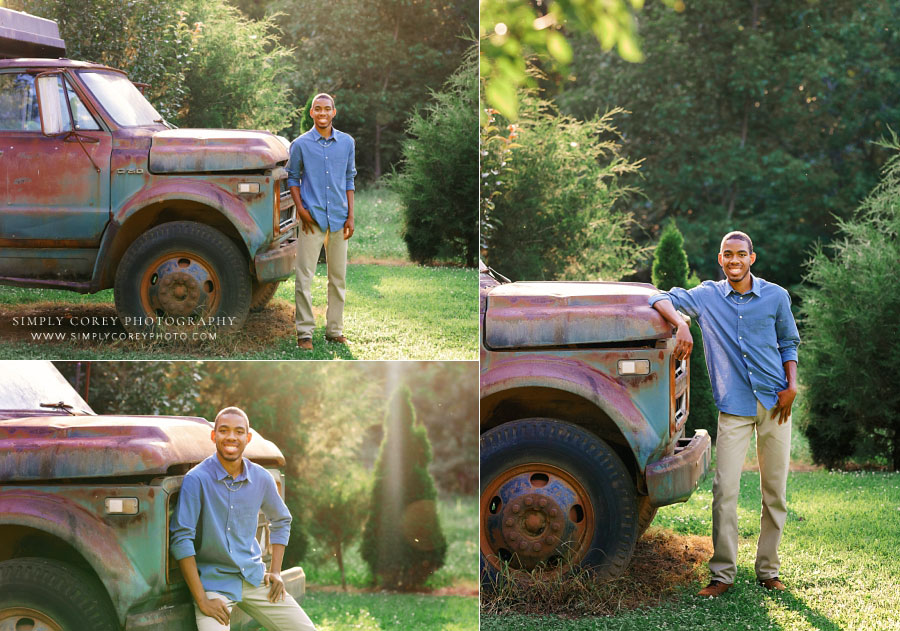 Villa Rica senior portrait photographer, teen boy outside with large vintage dump truck