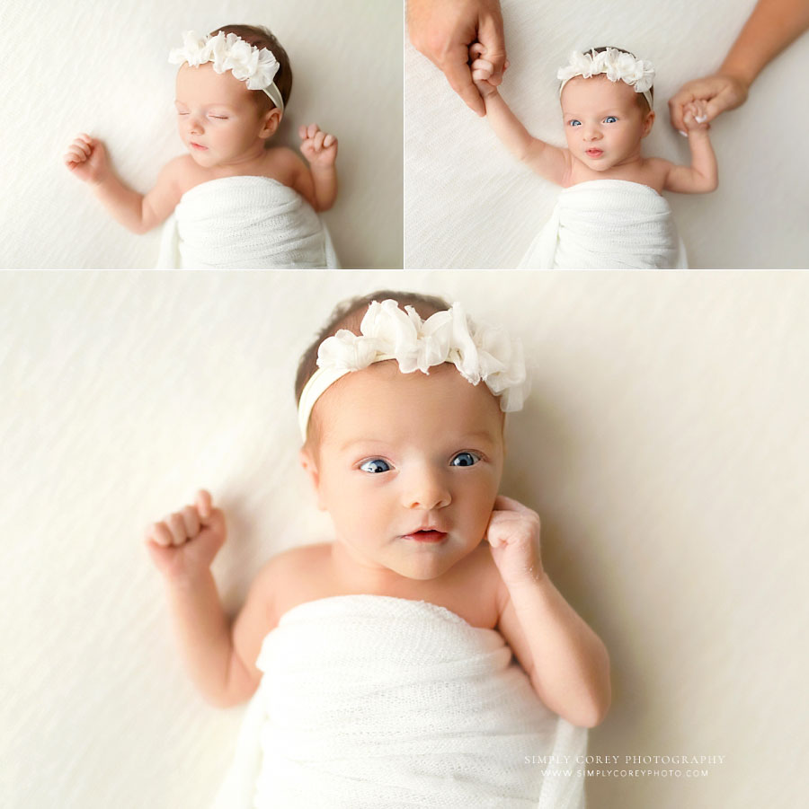 Douglasville newborn photography session, baby girl in white wrap with parents' hands