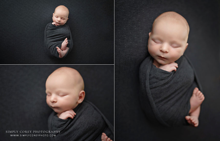 newborn photographer near Atlanta, baby boy in grey swaddle during studio session