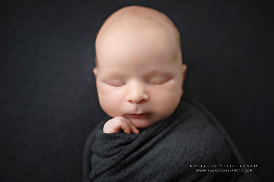 Villa Rica newborn photographer, baby boy swaddled in gray wrap