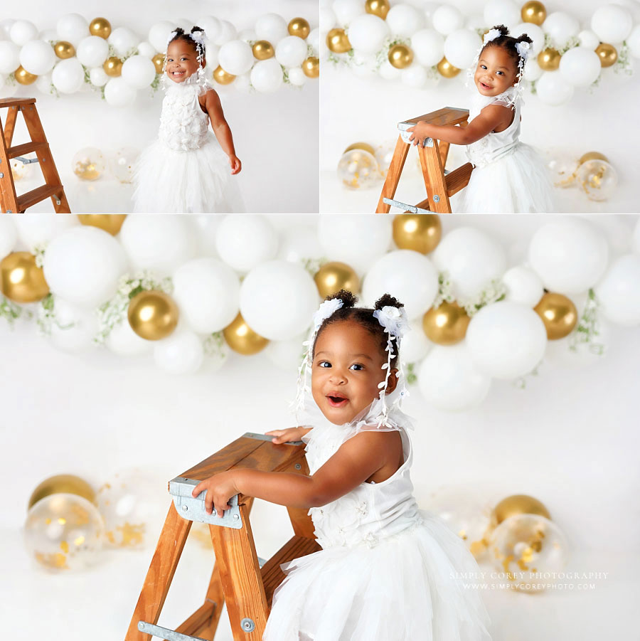 Fairburn baby photographer, one year old girl with white and gold studio milestone session