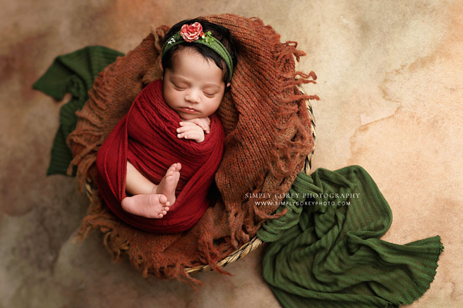 Atlanta newborn photographer, baby girl with dark jewel tone studio set