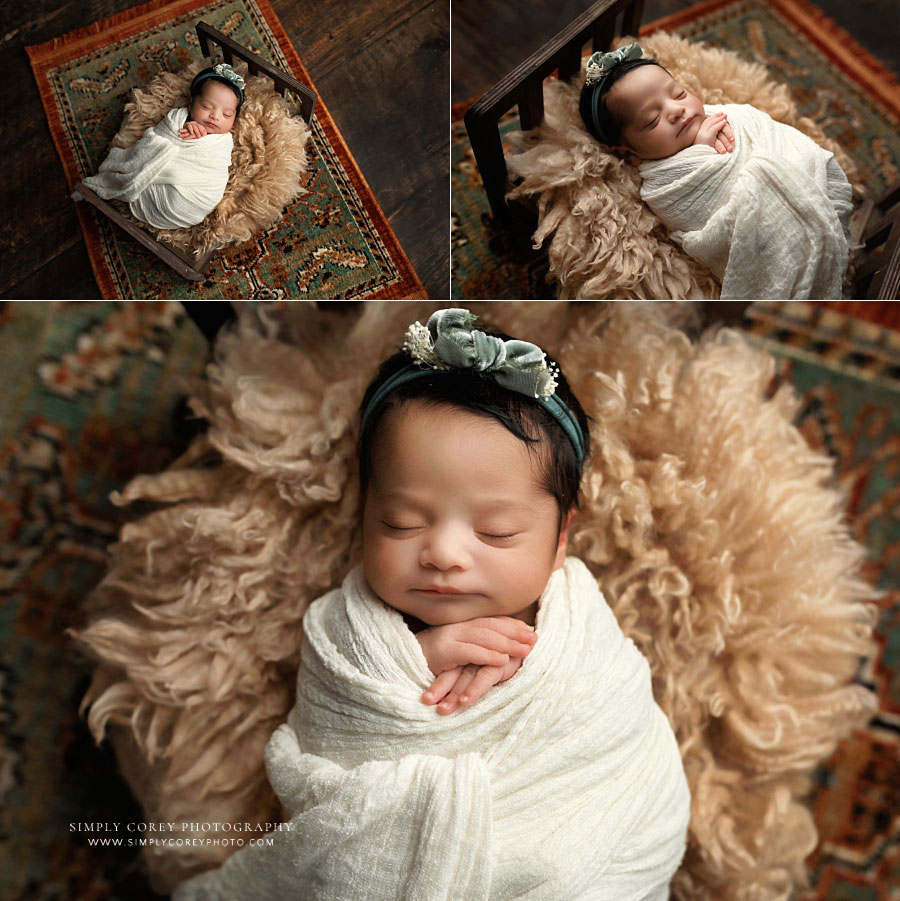Douglasville newborn photographer, baby girl in ivory wrap with flokati and colorful rug