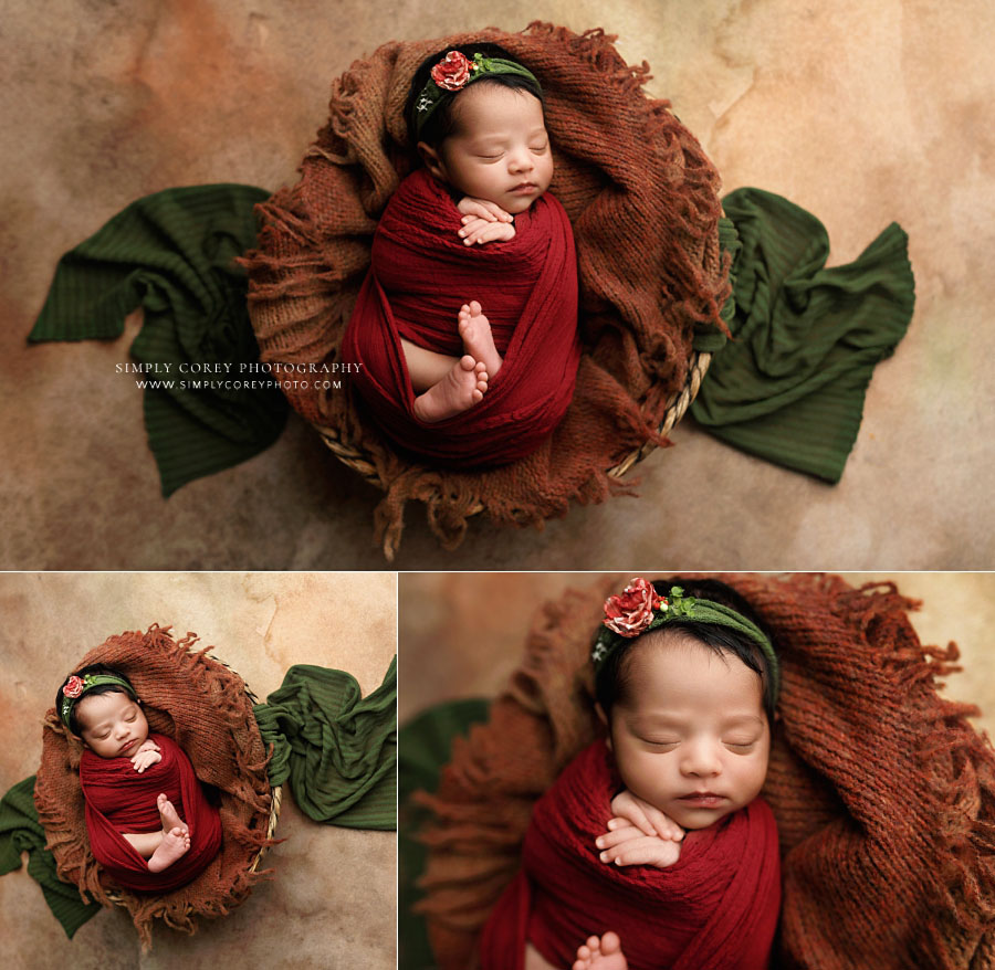 newborn photographer near Carrollton, Georgia; baby girl with burgundy orange and green studio set
