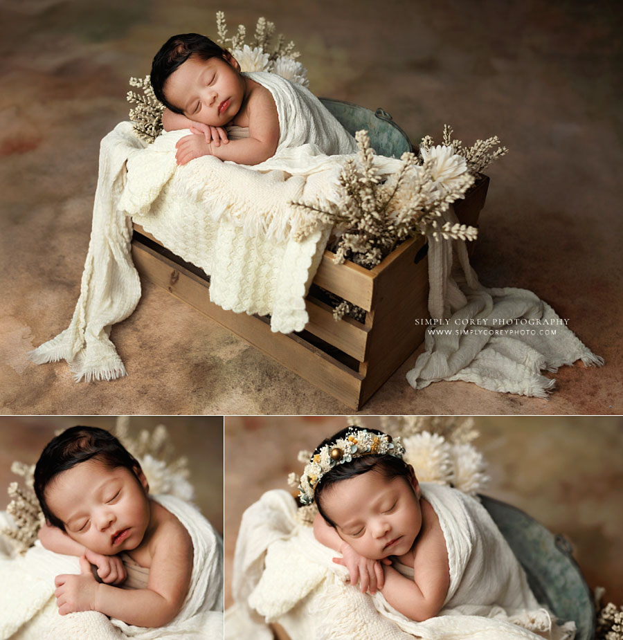 newborn photographer near Douglasville, baby girl in ivory studio set with flowers