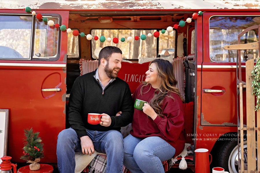 Mableton mini session photographer, couple with holiday mugs outside in VW Bus