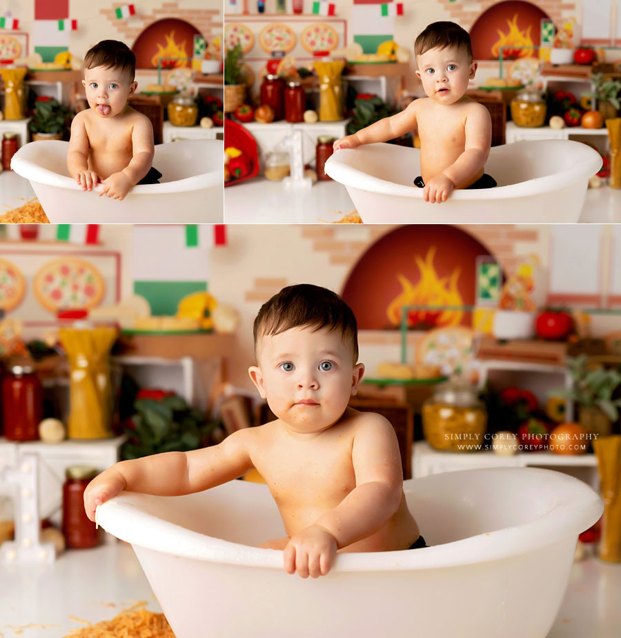 baby photographer near Carrollton, GA; boy in tub after spaghetti cake smash in studio