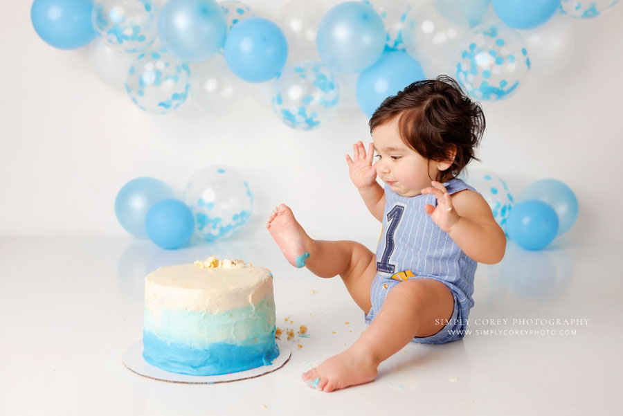 Villa Rica cake smash photographer, baby with toes in ombre cake on studio set