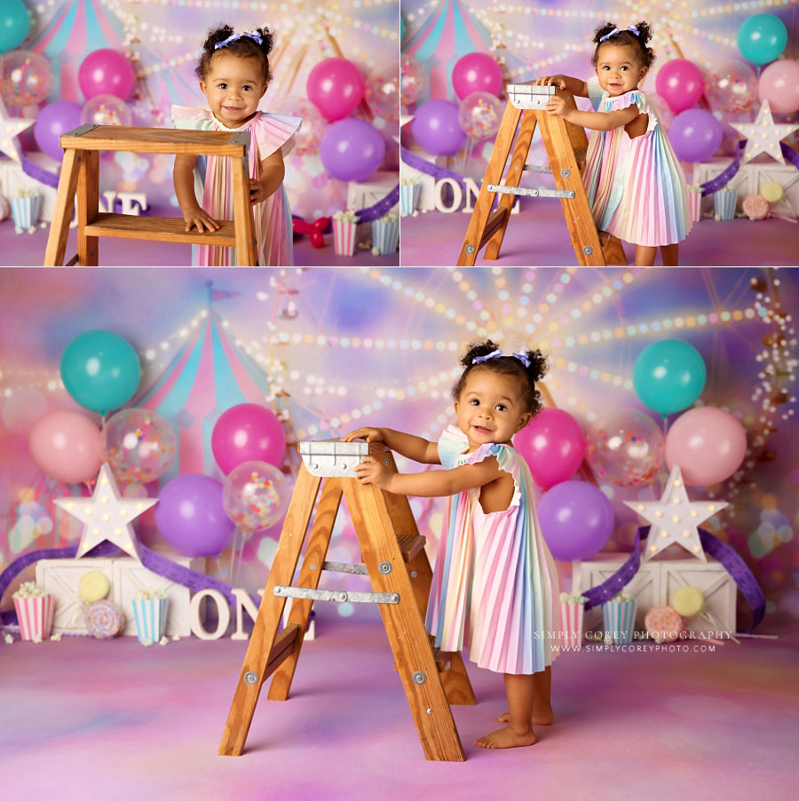 Villa Rica baby photographer, girl with ladder on pink circus studio set