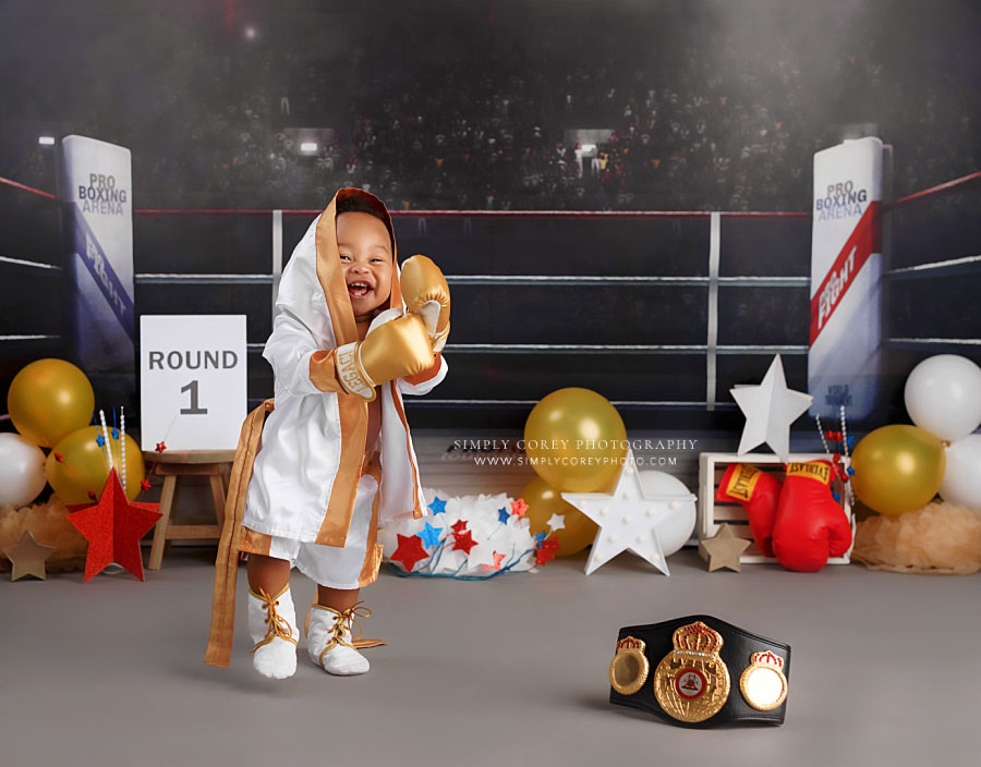 baby photographer near Villa Rica, studio milestone session with gold white boxing theme