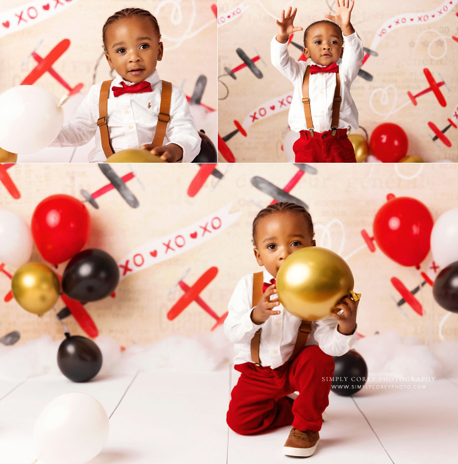 Carrollton baby photographer in GA, boy with balloons for valentine milestone session