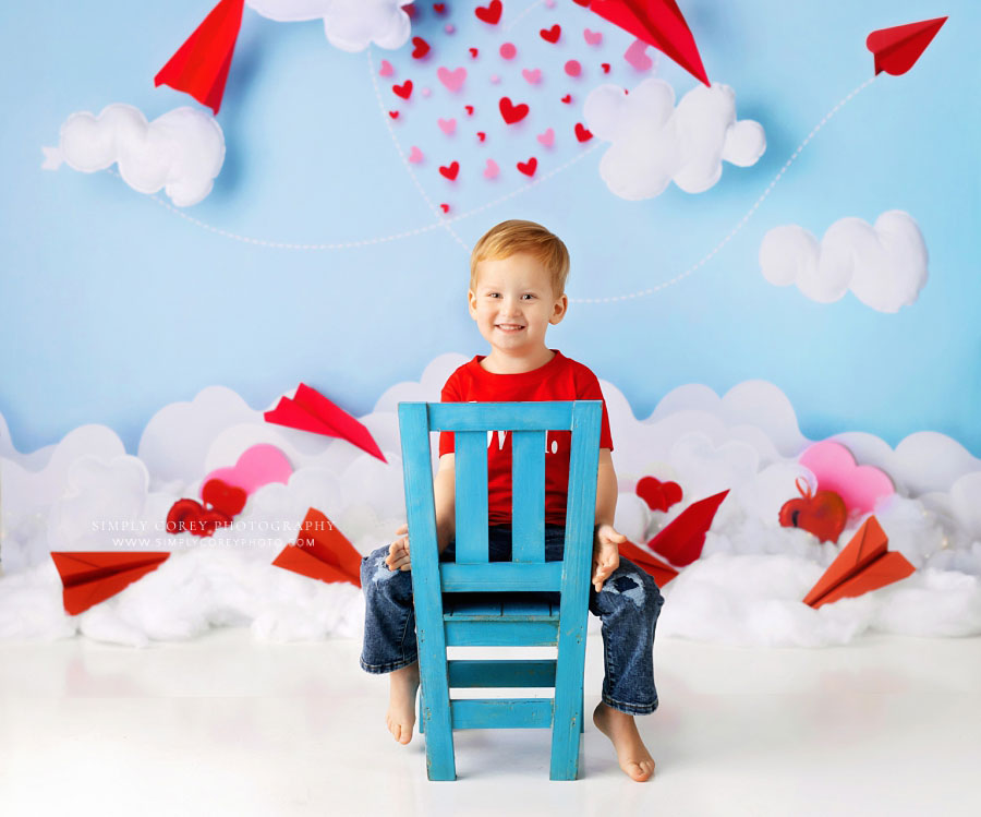 baby photographer near Villa Rica, boy on chair for Valentine's studio set