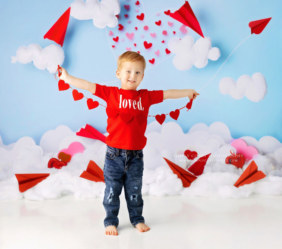 Tyrone baby photographer, boy holding hearts for Valentine's studio session