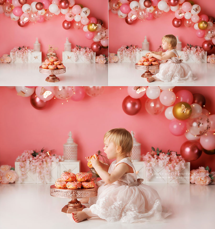 Villa Rica cake smash photographer, baby eating donuts on pink butterfly set