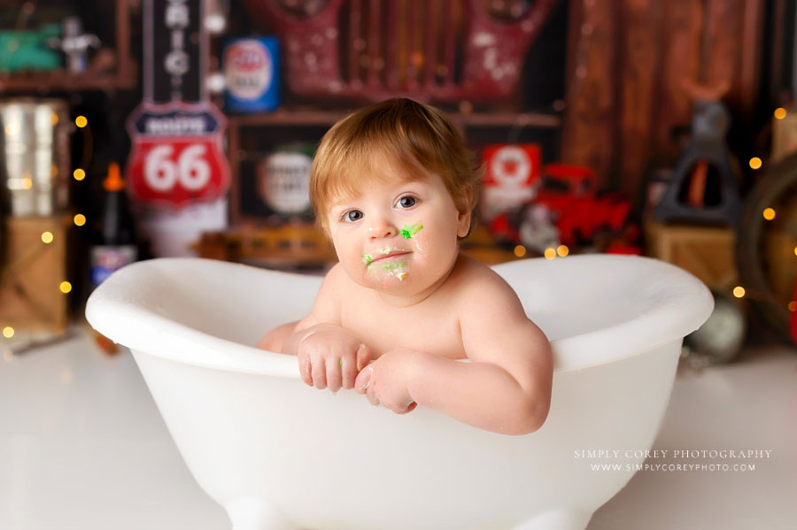 Bremen baby photographer, boy in tub after garage cake smash session