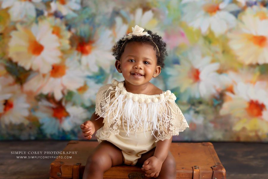 Atlanta baby photographer, one year milestone with daisy backdrop in studio