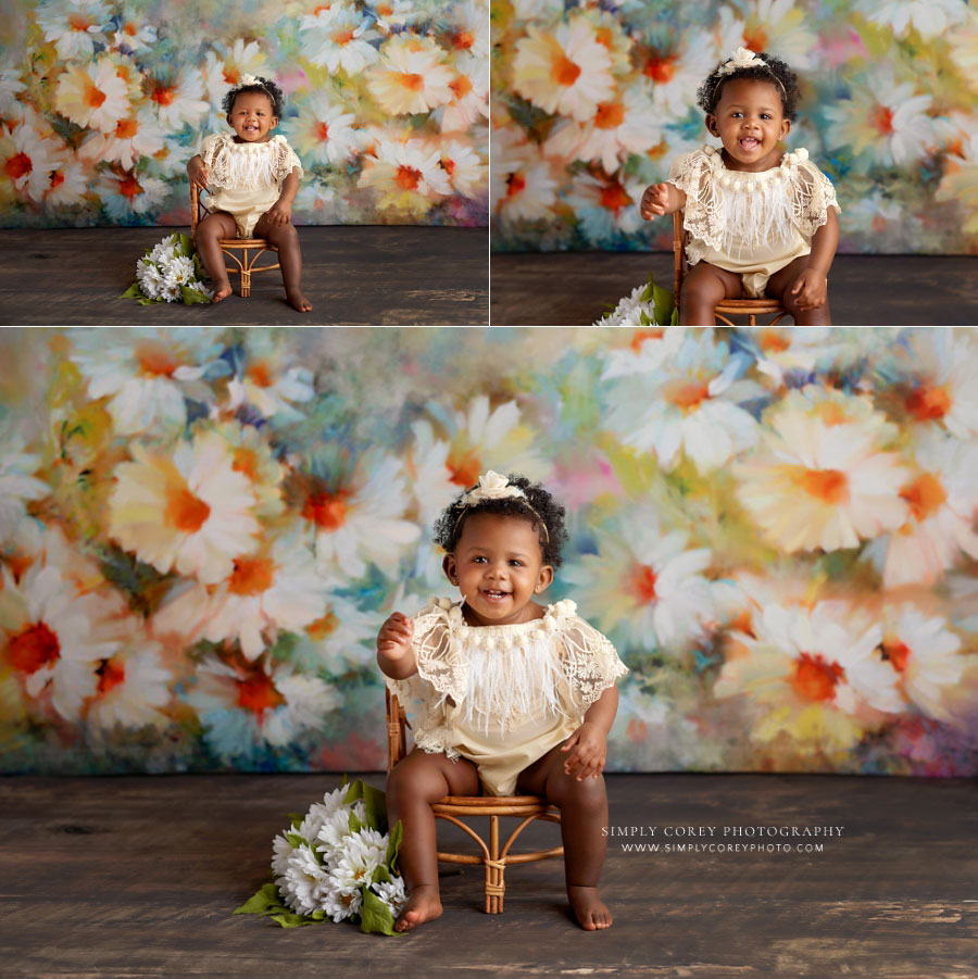 Fairburn baby photographer, girl in bamboo chair with daisy backdrop in studio