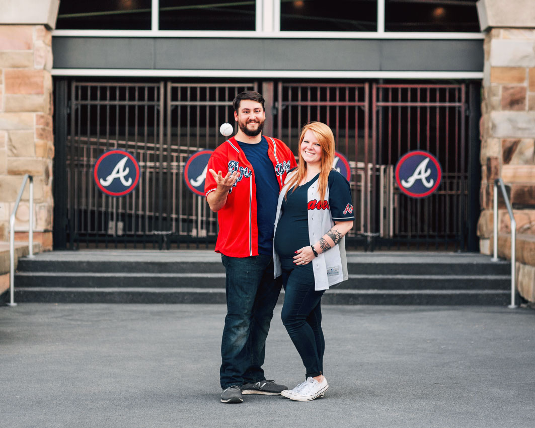 Atlanta maternity photographer, couple outside Truist Park Braves stadium