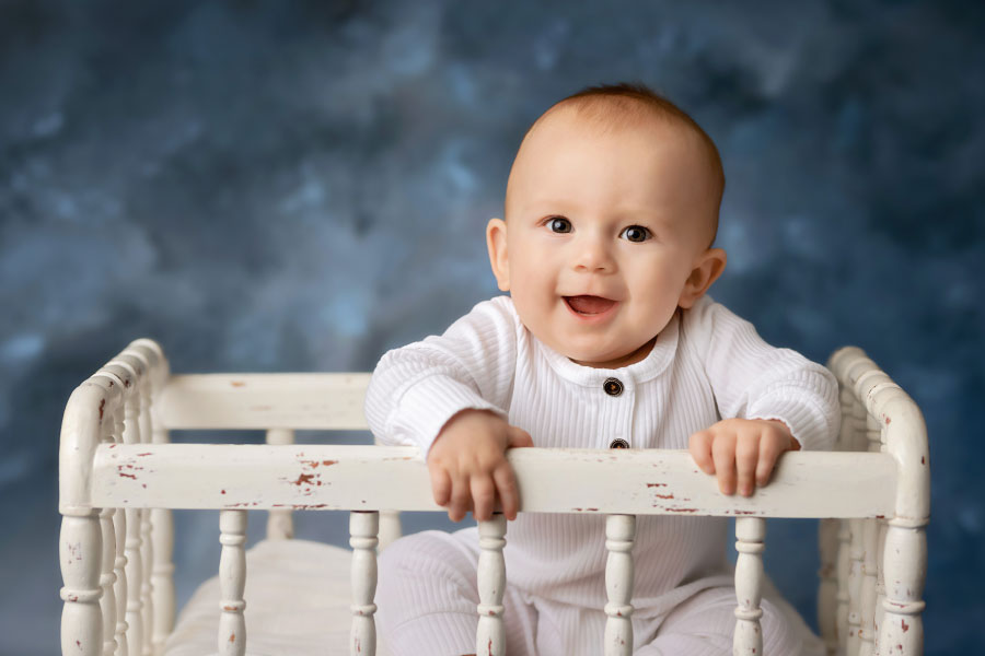 baby photographer near Dallas, GA; studio sitter session with white crib