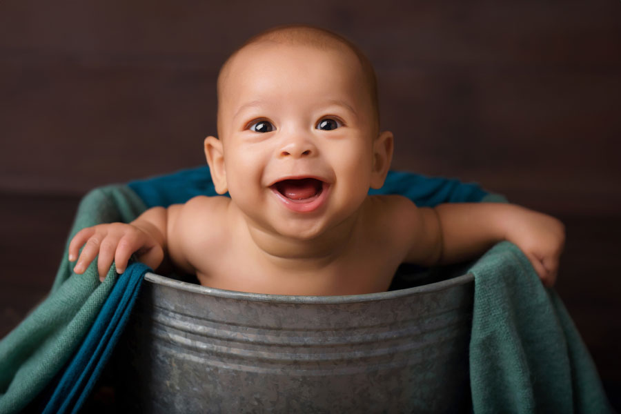 baby photographer near Douglasville, smiling boy in bucket prop