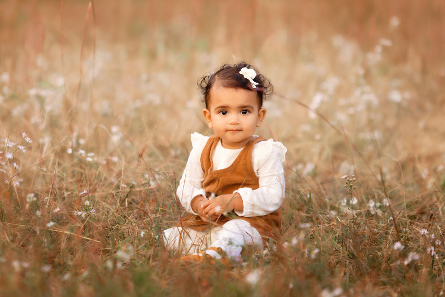 baby photographer near Hiram, girl in grassy field in autumn