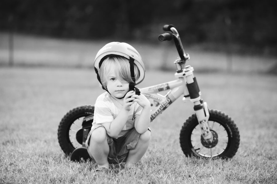 Carrollton kids' photographer in Georgia, boy outside with bicycle