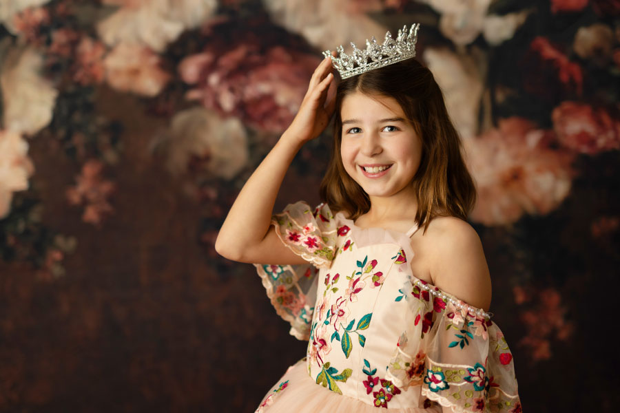 dream dress photographer near Atlanta, girl with floral backdrop and crown
