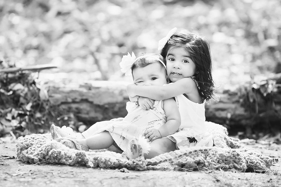 Mableton kids' photographer, big sister hugging baby sister