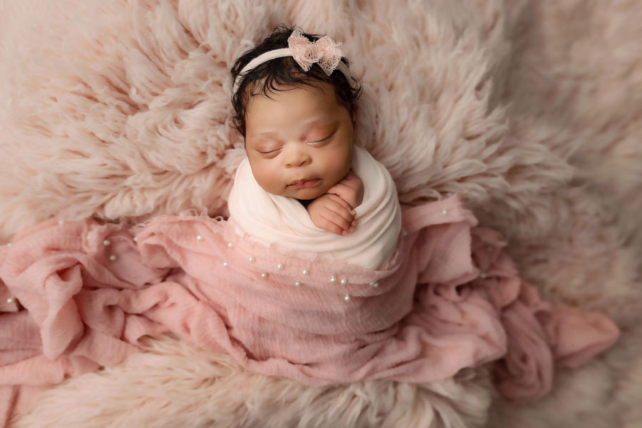 Mableton newborn photographer, baby girl on pink fur flokati