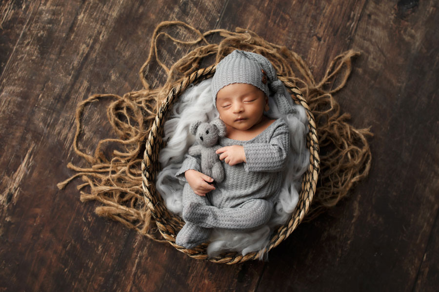newborn photographer near Dallas, GA; baby boy in grey with bear