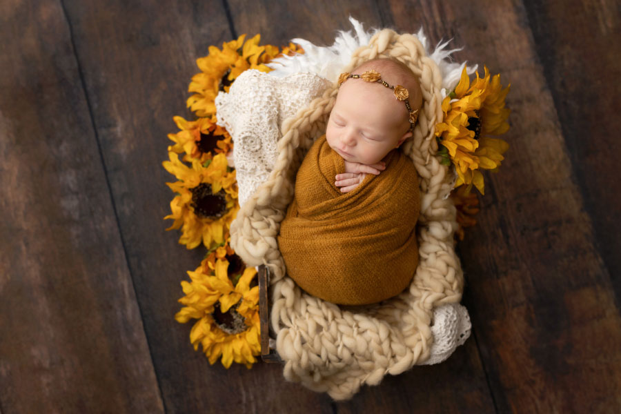 newborn photographer near Dallas, GA; baby girl with sunflowers