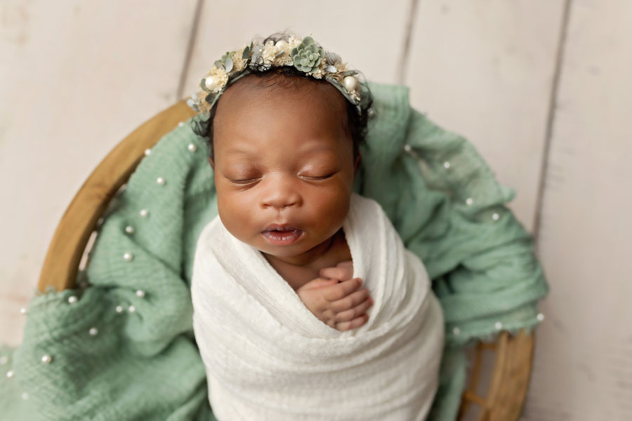 newborn photographer near Douglasville, baby girl with mint green studio set