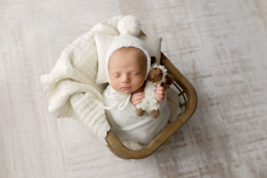 newborn photographer near Hiram, baby boy in white studio set