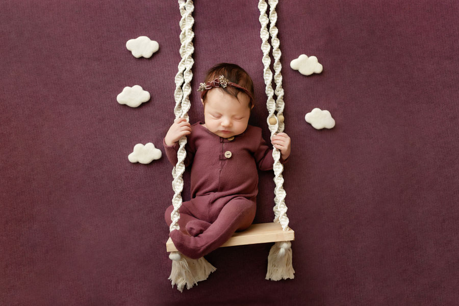 Newnan newborn photographer, baby girl in purple with swing and clouds