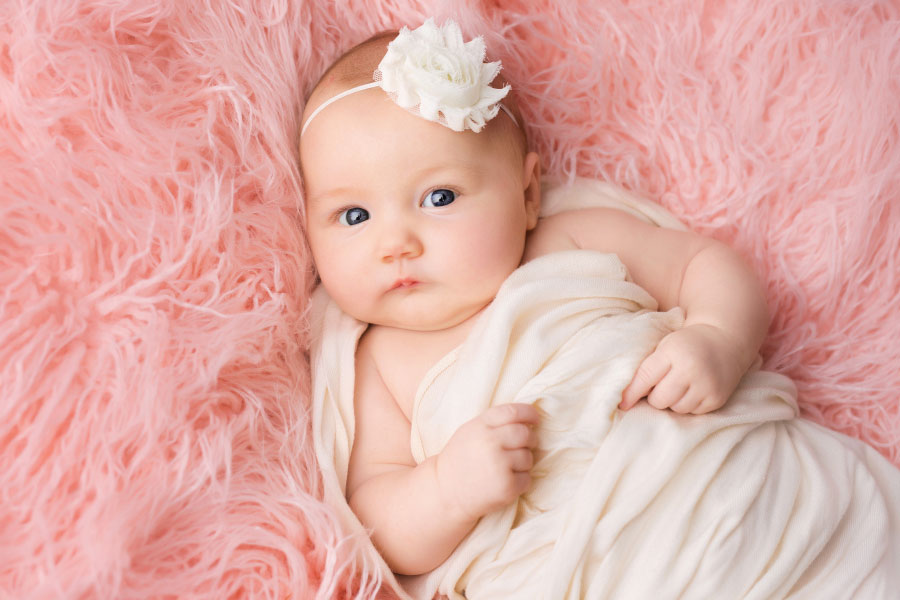 Powder Springs baby photographer, two month milestone session with pink fur